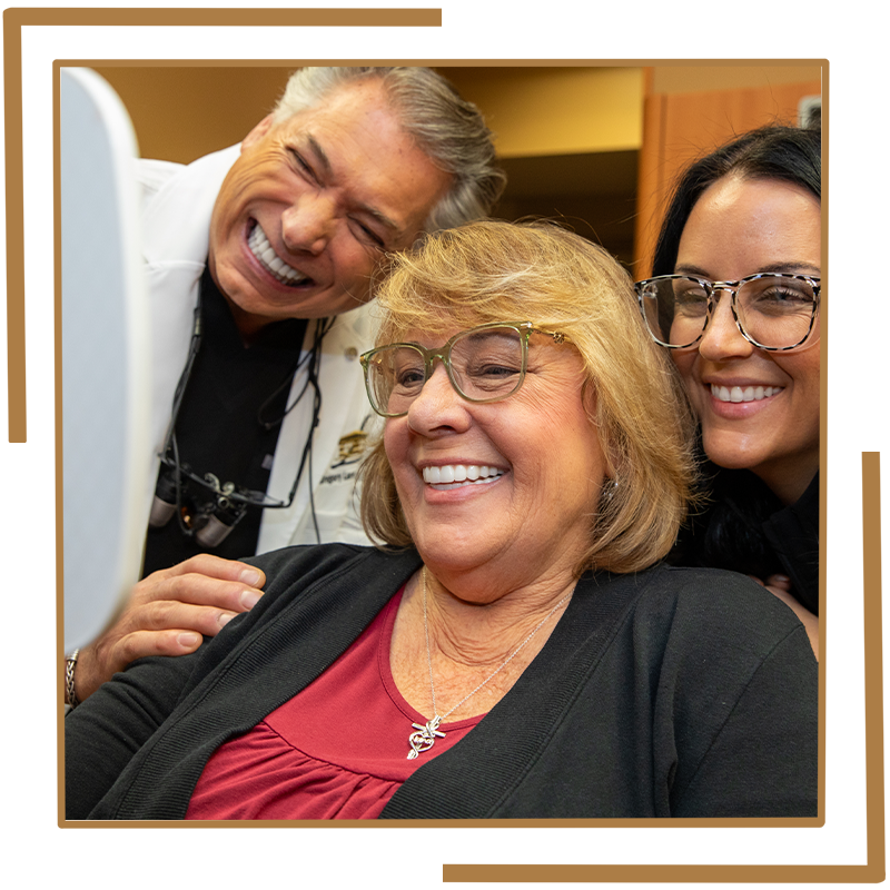 Patient smiling into mirror